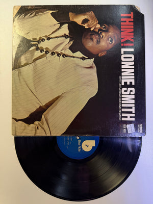 Vinyl record with cover featuring a musician and 'Think! Lonnie Smith' text on a white background