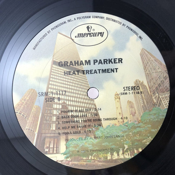 Used Vinyl Graham Parker - Heat Treatment LP NM-NM USED 10402