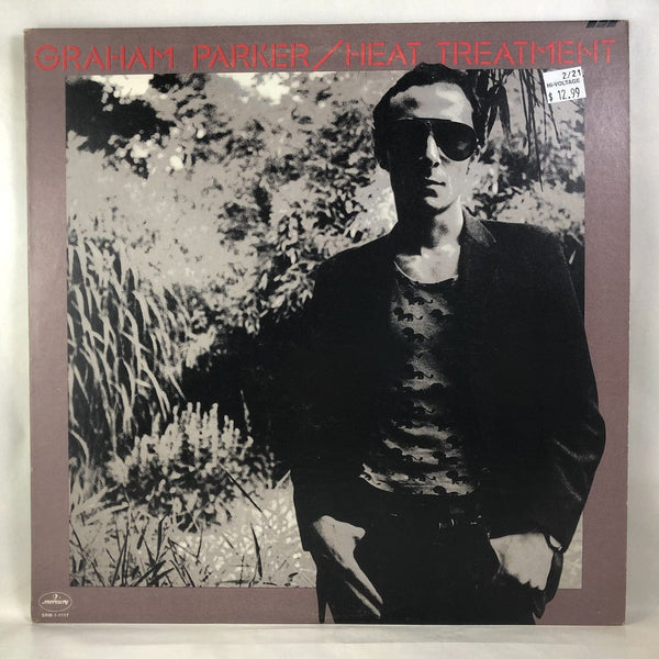 Used Vinyl Graham Parker - Heat Treatment LP NM-NM USED 10402