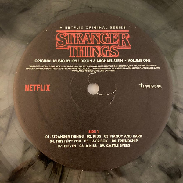 Used Vinyl Kyle Dixon, Michael Stein – Stranger Things - Volume One 2LP USED NM/NM Clear Black Smoke Vinyl J061823-04