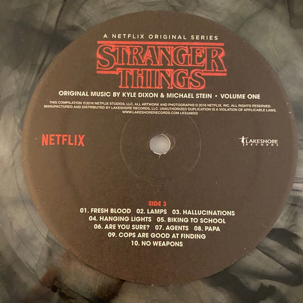 Used Vinyl Kyle Dixon, Michael Stein – Stranger Things - Volume One 2LP USED NM/NM Clear Black Smoke Vinyl J061823-04