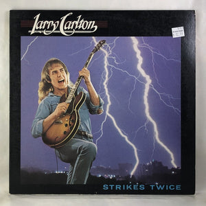 Used Vinyl Larry Carlton - Strikes Twice LP VG++-VG++ USED 13070