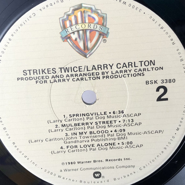 Used Vinyl Larry Carlton - Strikes Twice LP VG++-VG++ USED 13070