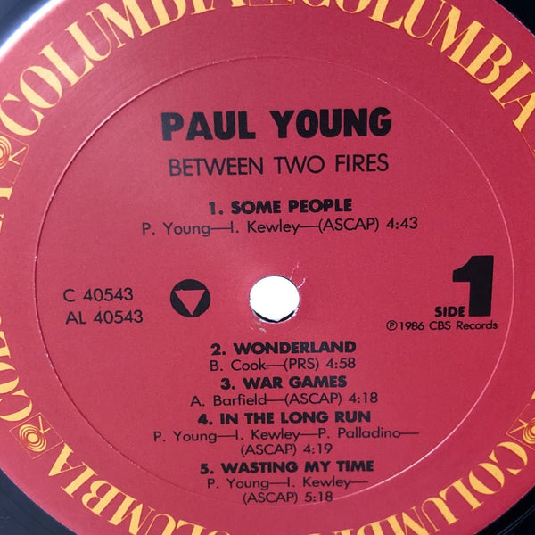 Used Vinyl Paul Young - Between Two Fires LP VG++-VG USED 12392