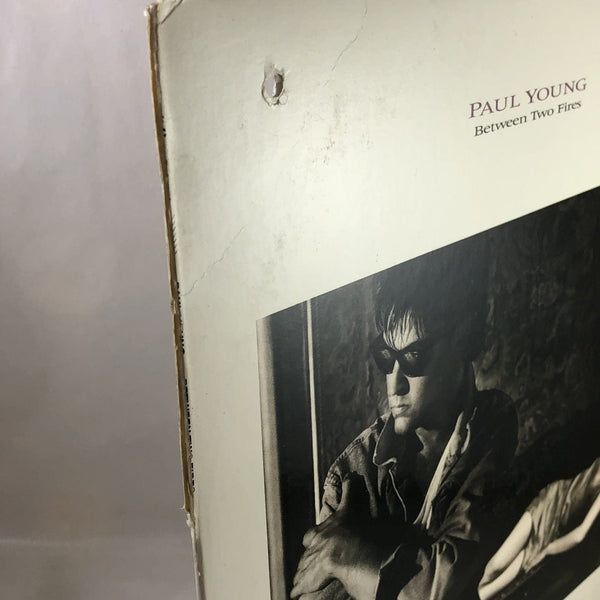 Used Vinyl Paul Young - Between Two Fires LP VG++-VG USED 12392